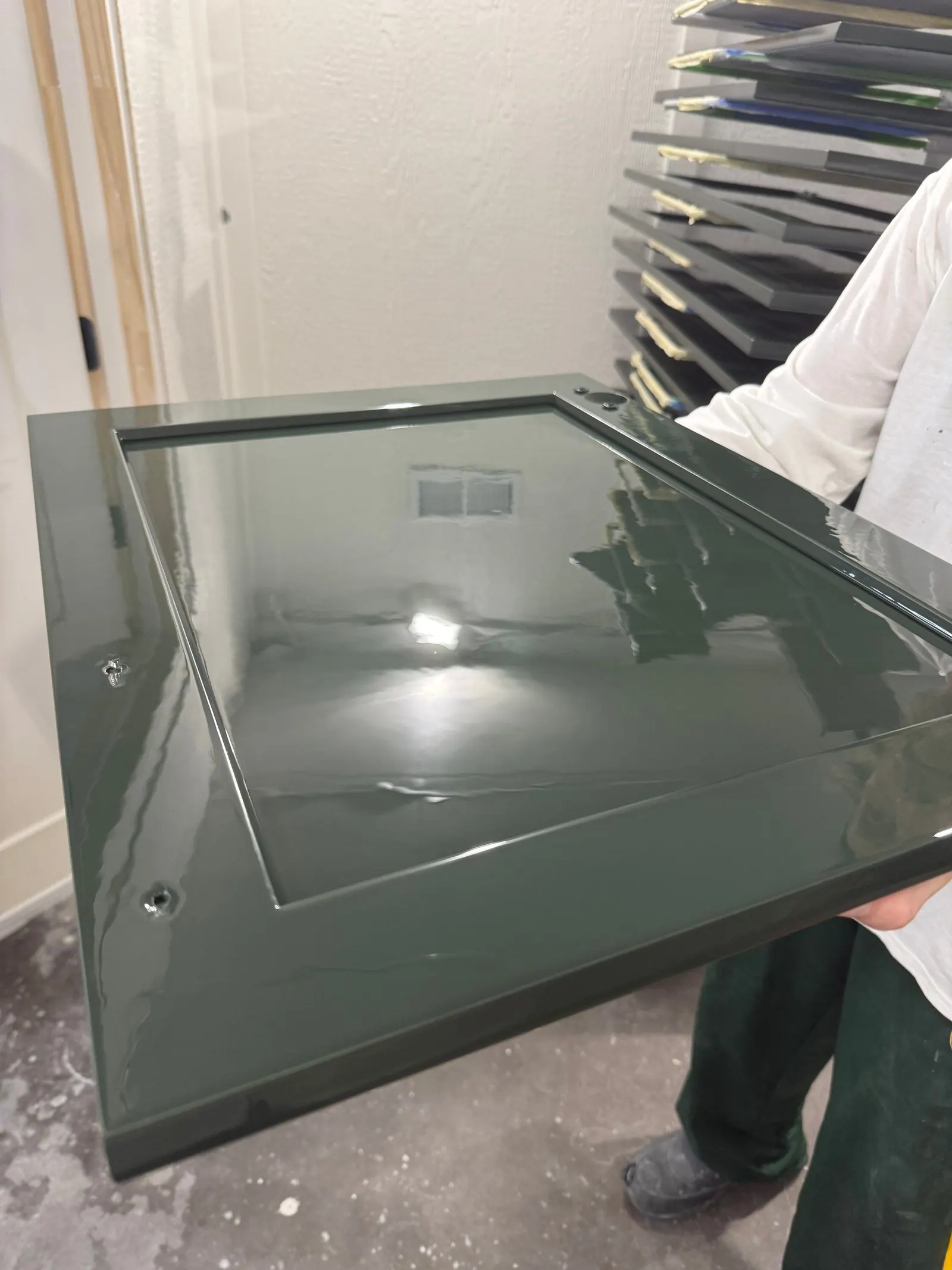Glossy urethane enamel finish on a freshly painted cabinet door